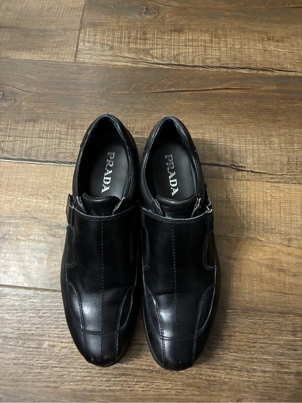 Prada Black Leather Slip-On Loafers with Subtle Buckle